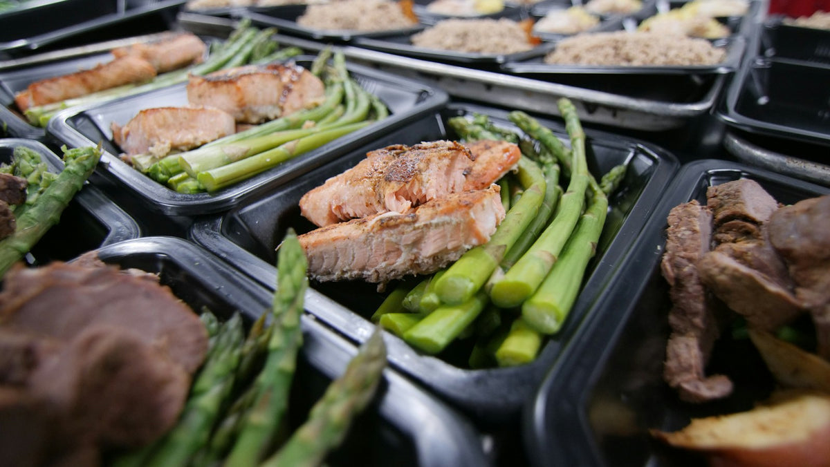 Meat and vegetables cooking on a grill