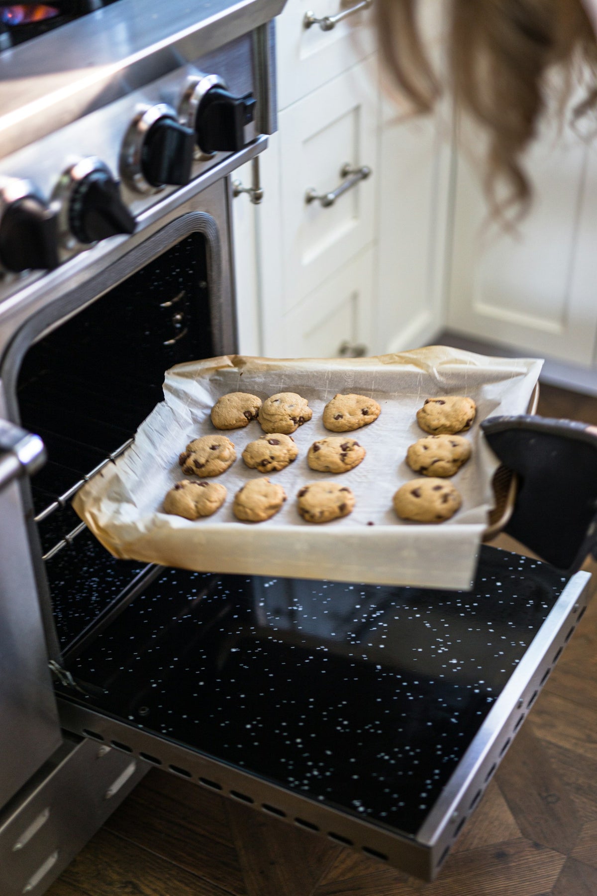 Freshly baked bread on a black baking tray