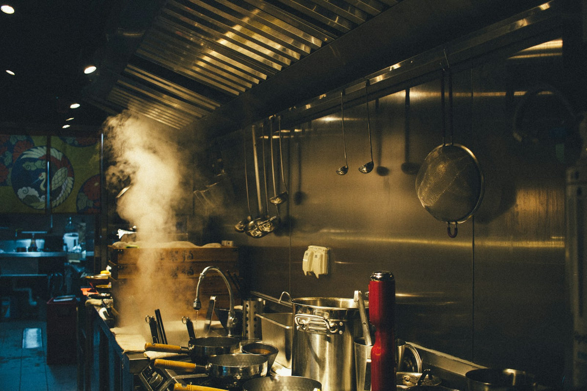 Stainless steel cooking pots on a stove